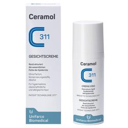 Weiße Gesichtscreme-Flasche und Verpackung mit blauer Aufschrift "Ceramol 311".